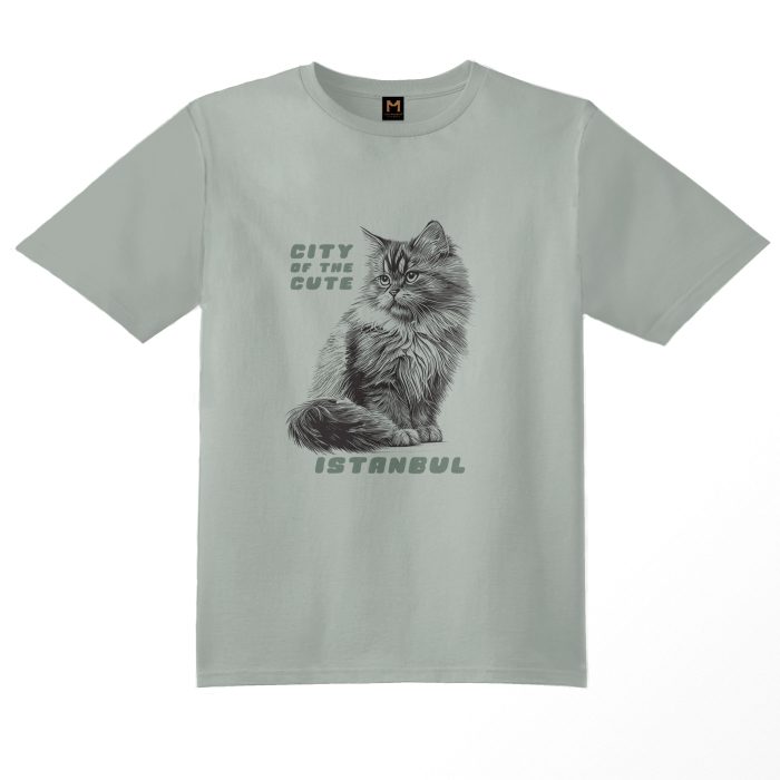 Sage green T-shirt featuring a graphic of a kitten cat sitting on its paws with the text 'Istanbul, City of the Cute available on cat museum Istanbul